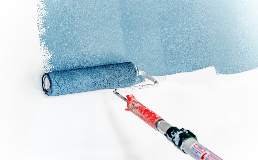 Decorator applying paint to an interior wall with even coverage